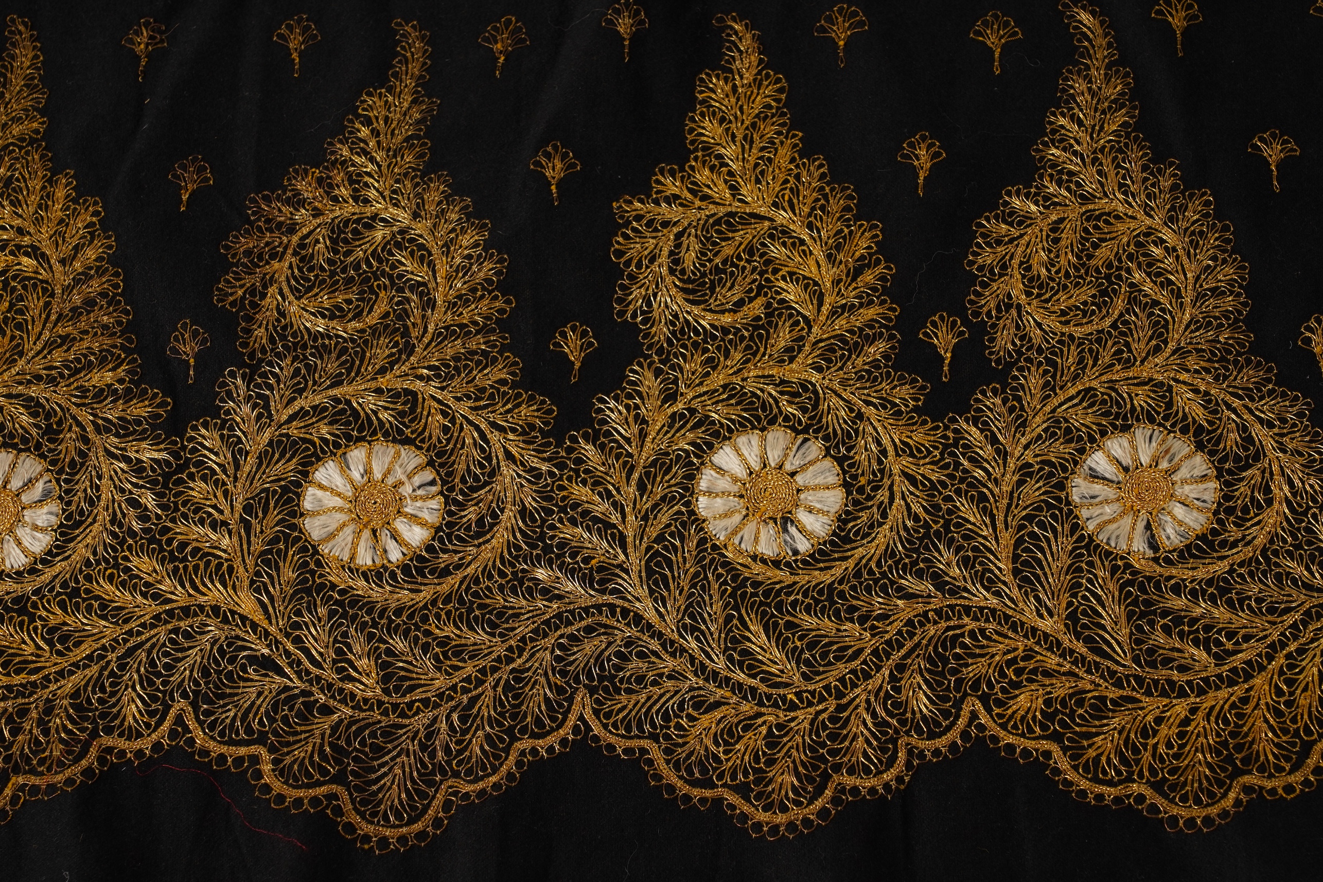 Four Chinese embroidered silk panels, late 19th/early 20th century and a similar Indian panel
